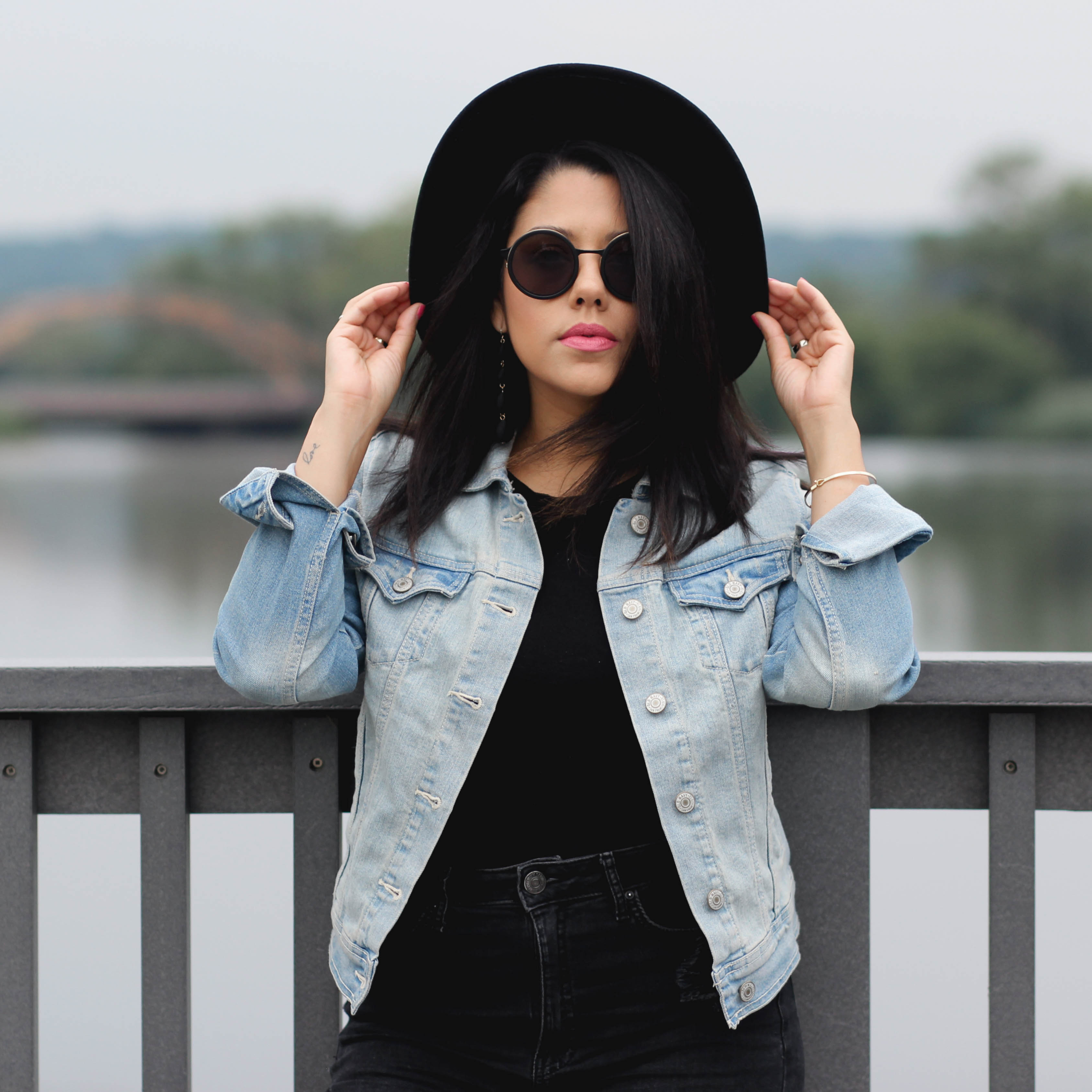 Lifestyle blogger Naty Michele wearing black on black with a denim jacket