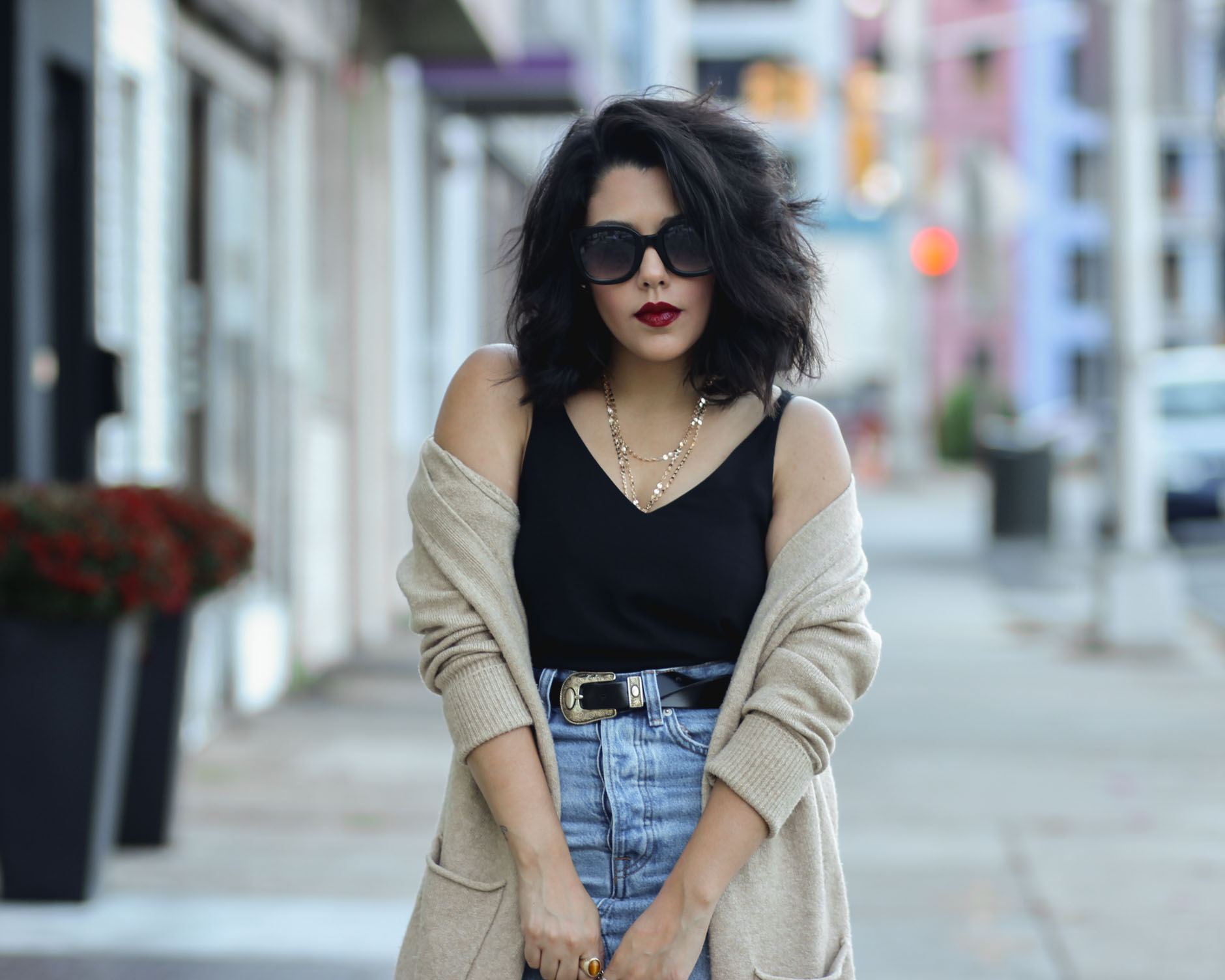 close up of style blogger naty michele wearing an oversized cardigan
