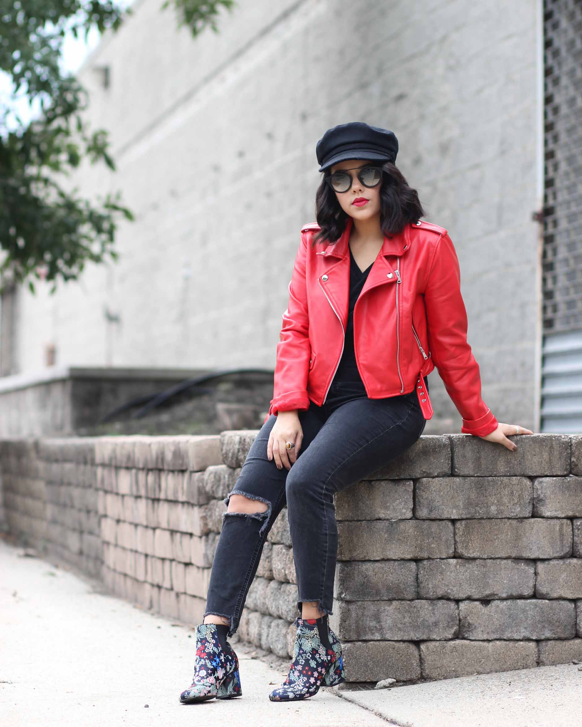 lifestyle blogger naty michele wearing red leather jacket and floral booties 