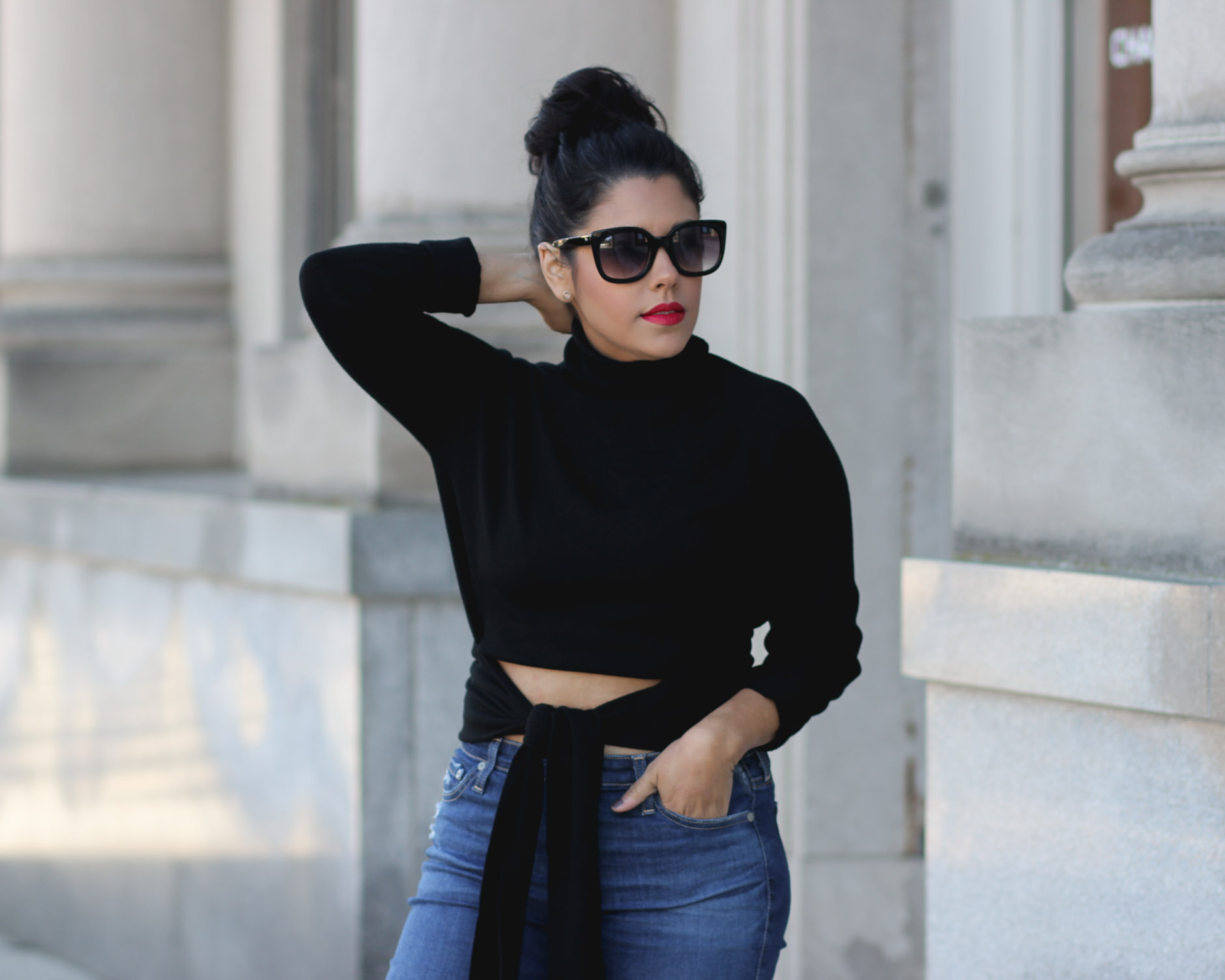lifestyle blogger naty michele hair in a bun wearing a kendall and kylie sweater