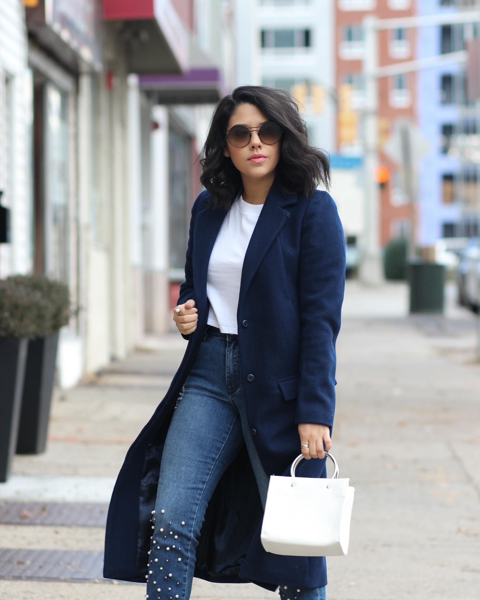 lifestyle blogger naty michele wearing pearl jeans and navy coat
