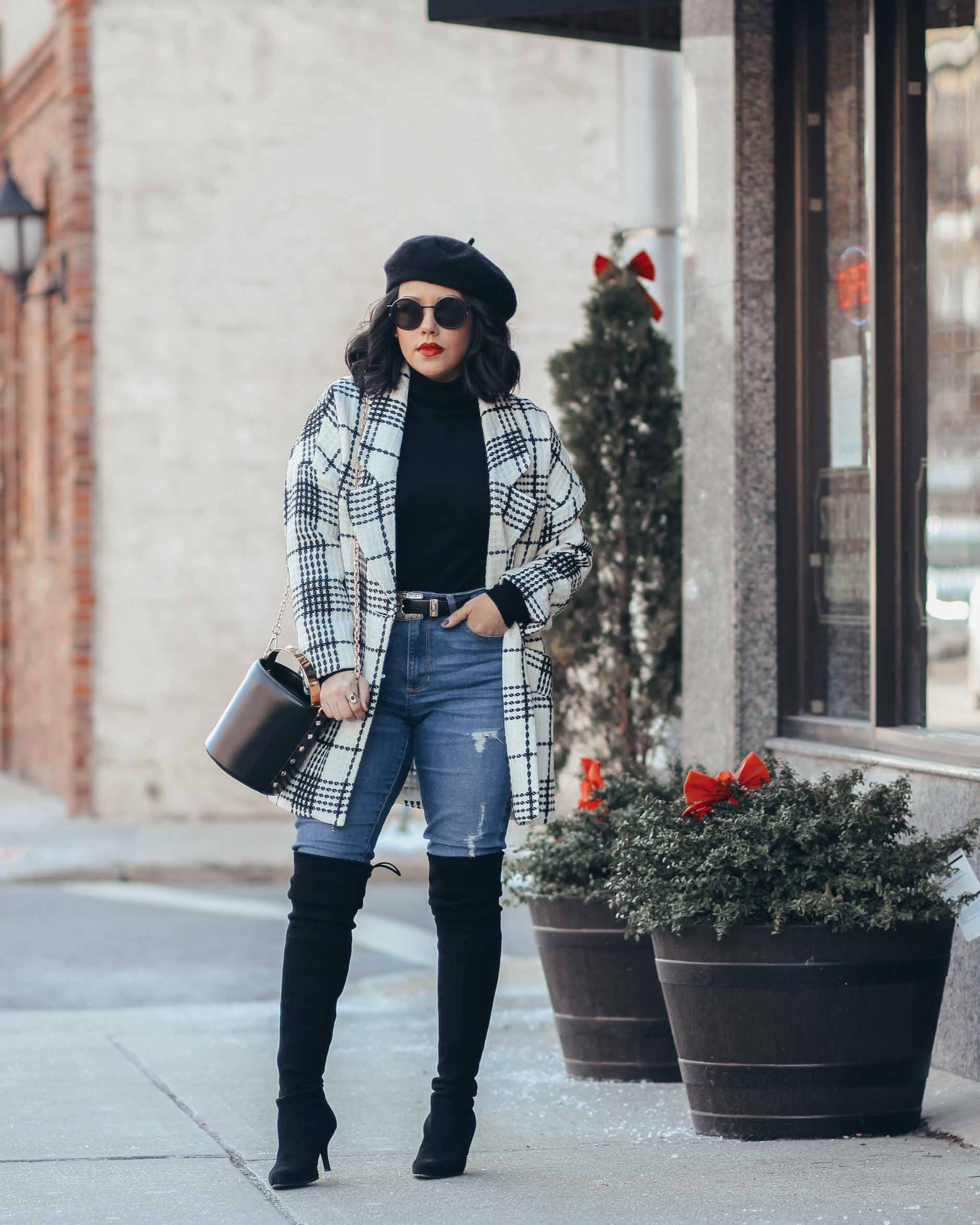lifestyle blogger naty michele wearing a white and black coat with a beret and otk boots
