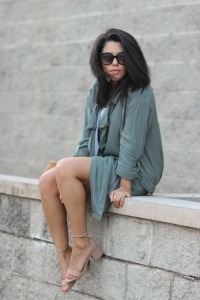 lifestyle blogger naty michele sitting down wearing a trench coat