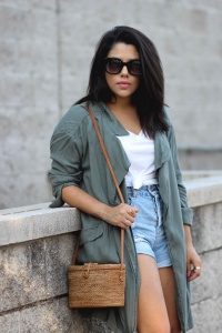 lifestyle blogger naty michele wearing a draped trench coat with a knotted tee and denim shorts