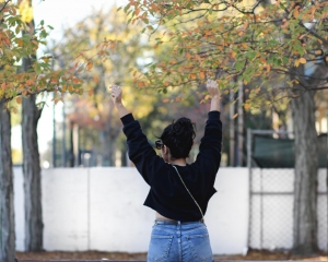 lifestyle blogger naty michele wearing a black cropped sweatshirt