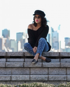 lifestyle blogger naty michele wearing pearl jeans and a black sweater