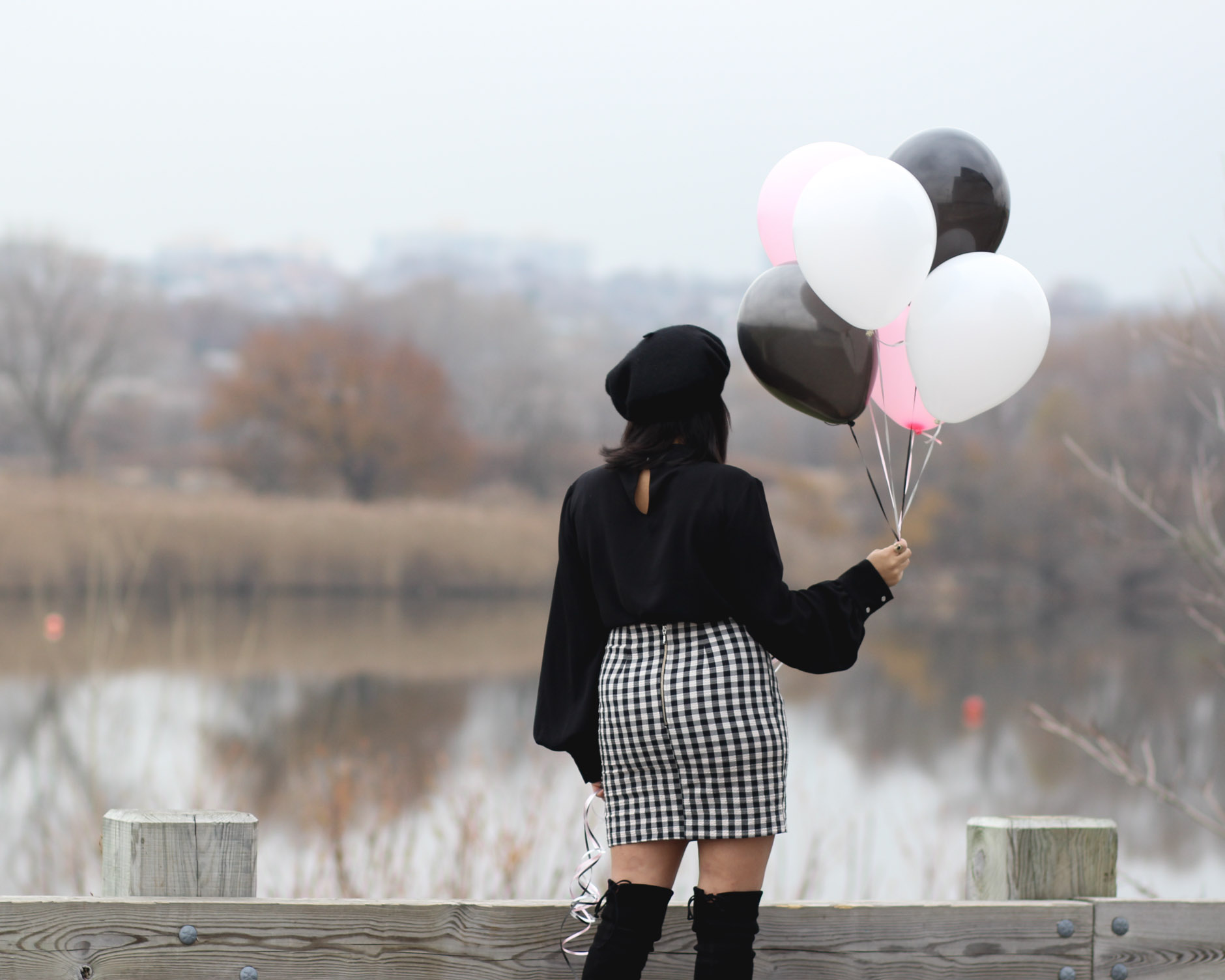 lifestyle blogger naty michele holding balloons 