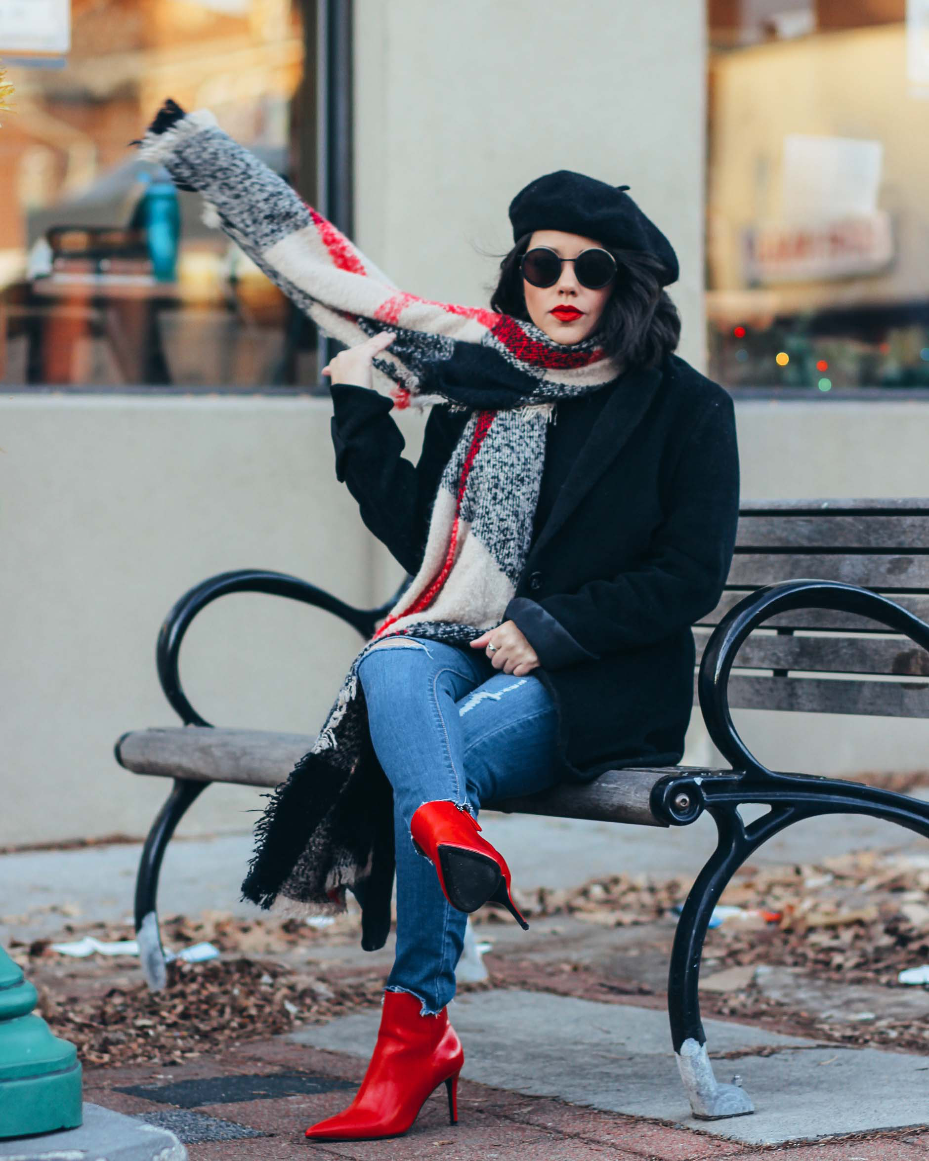naty michele wearing a beret, red boots and plaid scarf