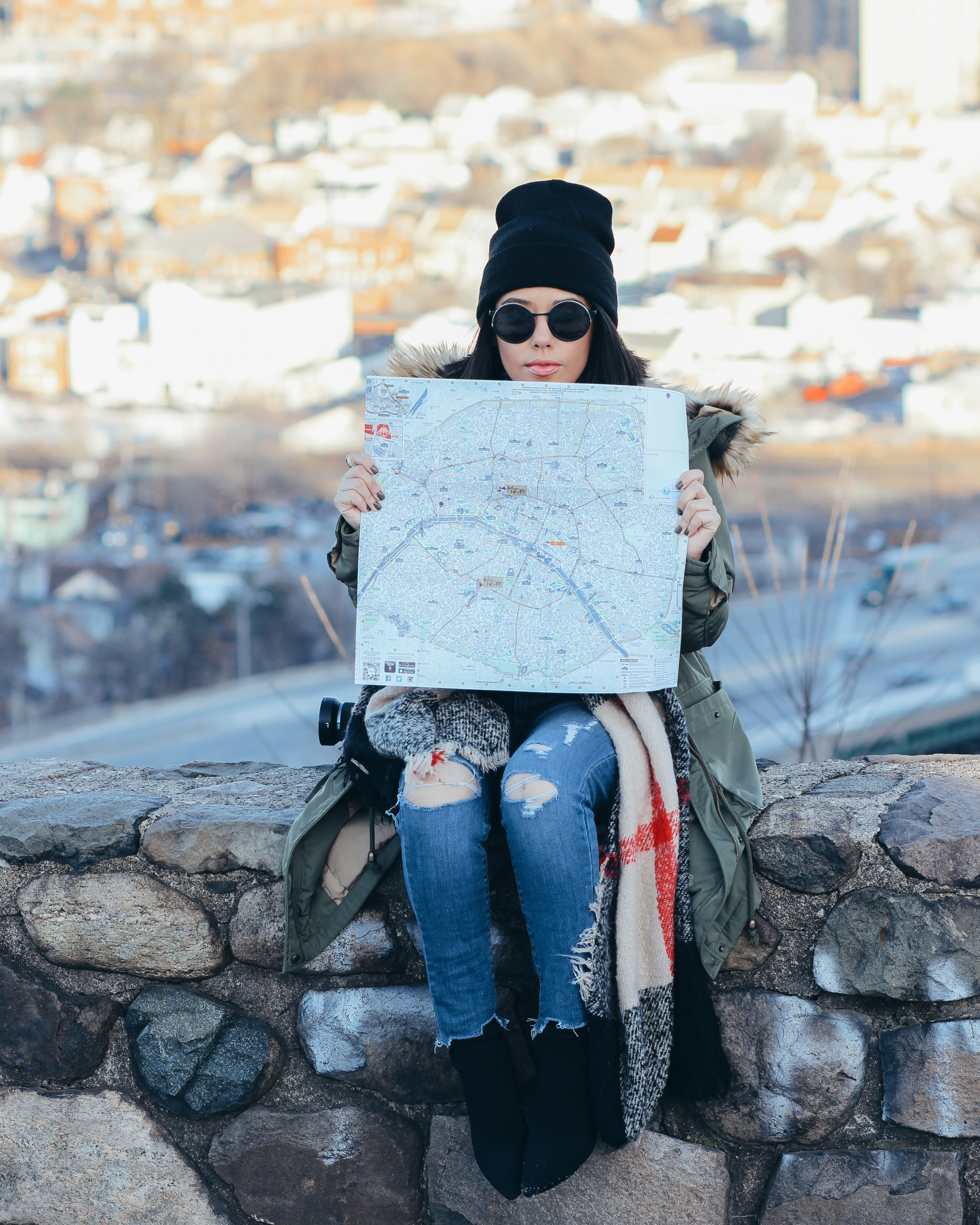 lifestyle blogger naty michele holding a map