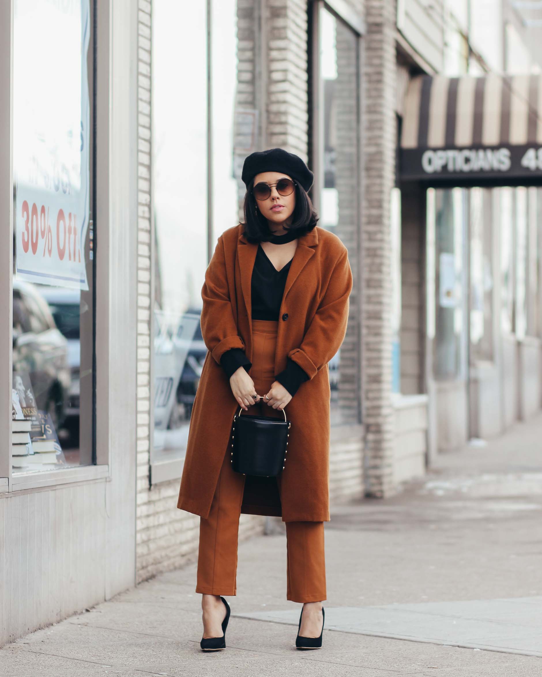 lifestyle blogger naty michele wearing a camel and black outfit