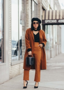 lifestyle blogger naty michele wearing a camel and black outfit