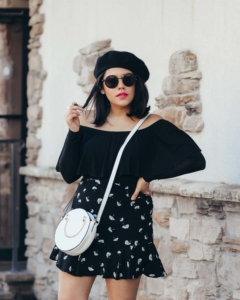 naty michele wearing a beret and off the shoulder top