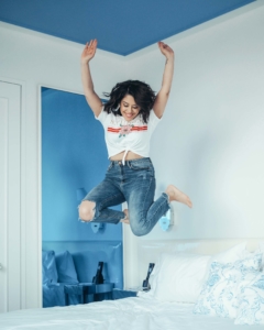 naty michele jumping on the bed