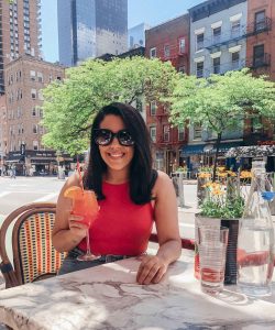 naty michele in nyc with an aperol spritz on a solo date